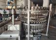 M�quina de llenado rotativa de acero inoxidable para bebidas carbonatadas y refrescos, 42 boquillas, KHS con lavadora Zegla.