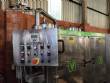 Llenadora rotativa gravimtrica de acero inoxidable con cabina