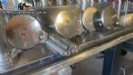 Llenadora rotativa gravimtrica de acero inoxidable con cabina