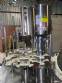 Llenadora rotativa gravimtrica de acero inoxidable con cabina
