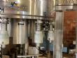 Llenadora rotativa gravim�trica de acero inoxidable con cabina