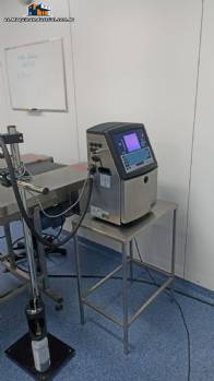 Cinta transportadora con fechador y mesa de apoyo en acero inoxidable de 10 metros