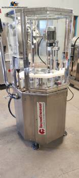 Enroscadora de botellas y tarros con sistema automático de alimentación de tapones Enroscadora de botellas y tarros con sistema automático de alimentación de tapones